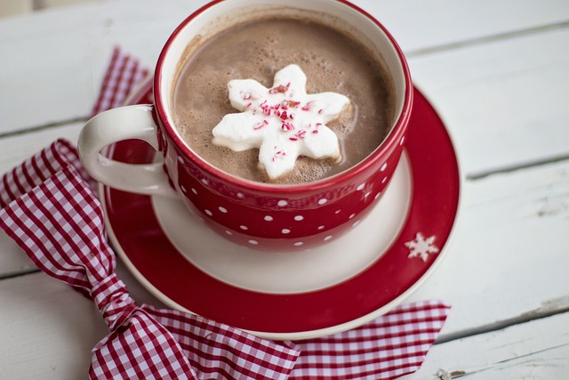 An image capturing the warmth and richness of hot chocolate: a cozy café with rustic wooden interiors, adorned with steaming mugs of velvety hot cocoa, topped with swirls of whipped cream and a sprinkle of cocoa powder