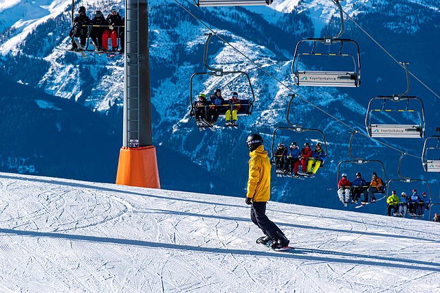 An image showcasing the thrilling winter playground of a nearby ski resort: snow-capped peaks, skiers gracefully gliding down slopes, snowboarders performing daring tricks, and the resort's cozy chalets nestled amidst breathtaking alpine scenery