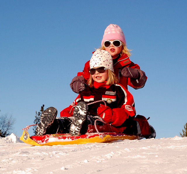 An image capturing the exhilarating joy of sledding at the local park